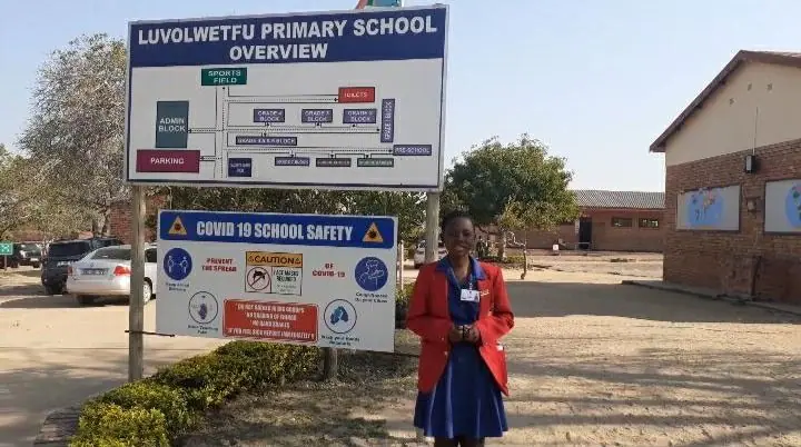 Facilitator outside Luvolwethu Primary School