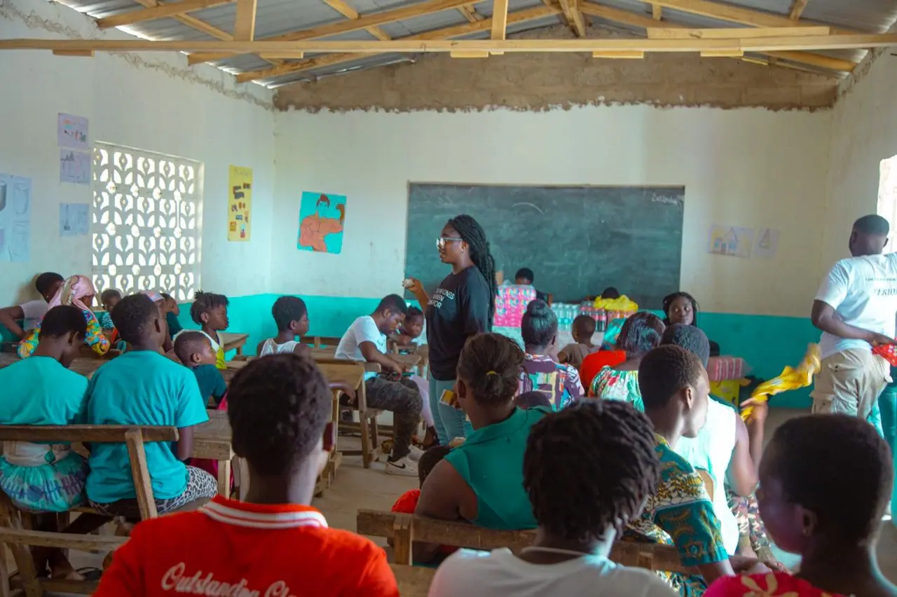 Facilitator speaking to learners in a classroom