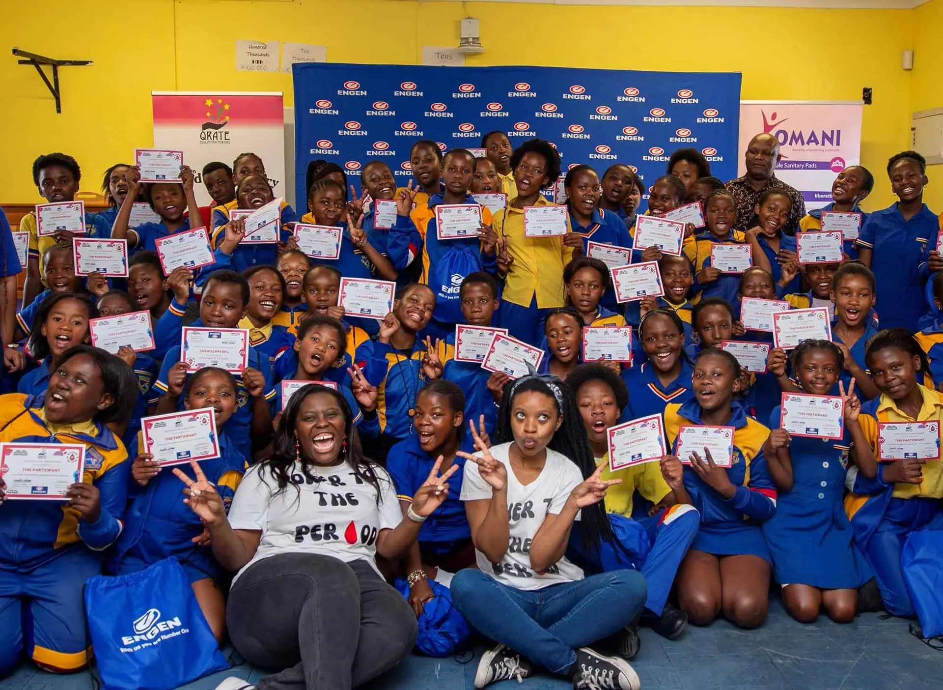 Large group of schoolgirls holding their certificates
