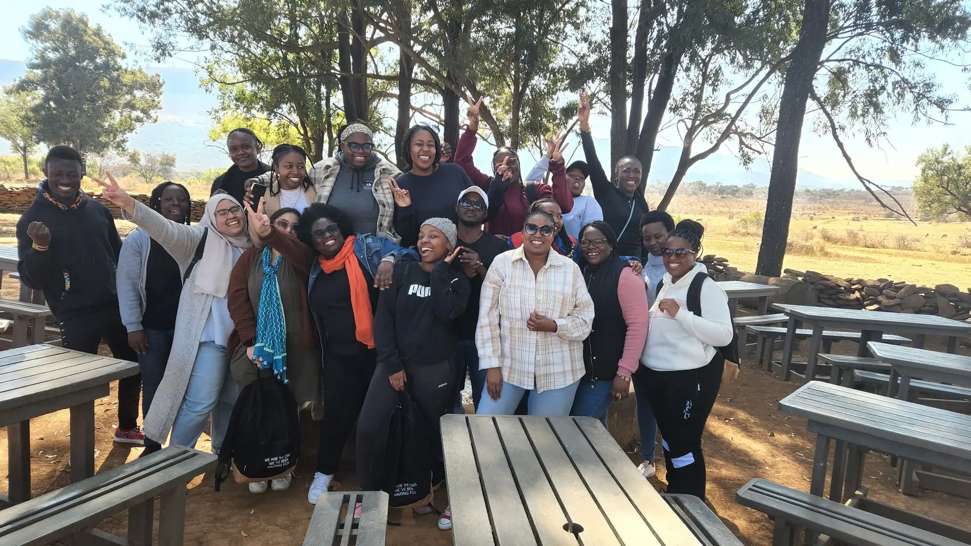 Participants gathered outdoors at a lodge