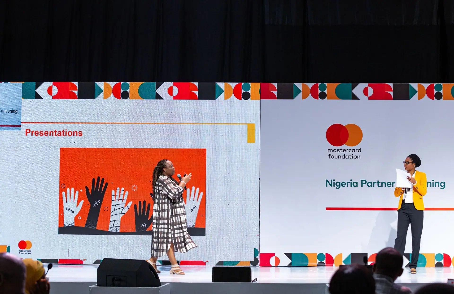 Speaker presenting on stage at a partnership event